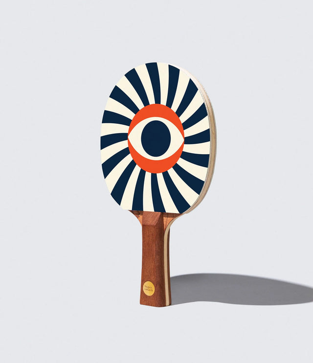 Ping pong paddle with a decorative design on a light gray background