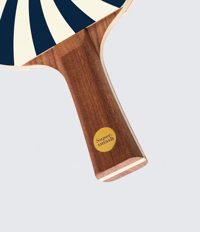Wooden paddle with 'Supersmash' logo on a white background